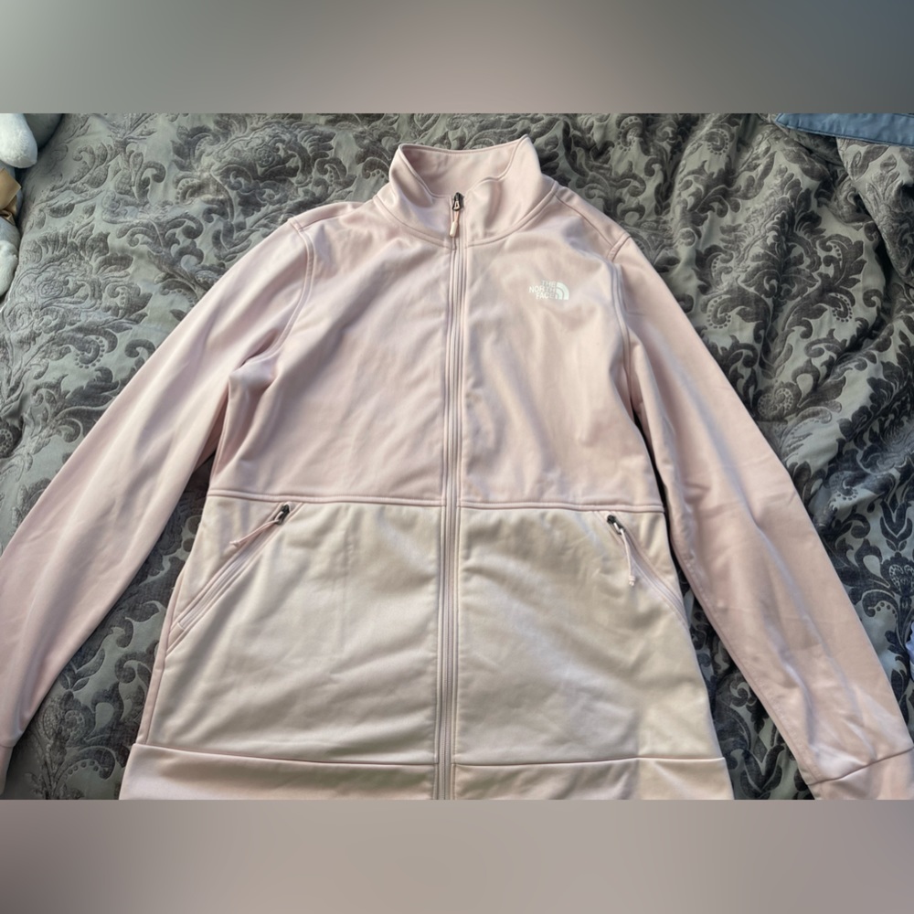 Only worn once! Light pink long sleeve North Face zip up with pockets